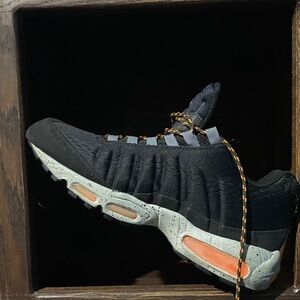 Nike. Honolulu 95 Men's Black and Gray Sneakers with Orange Accents